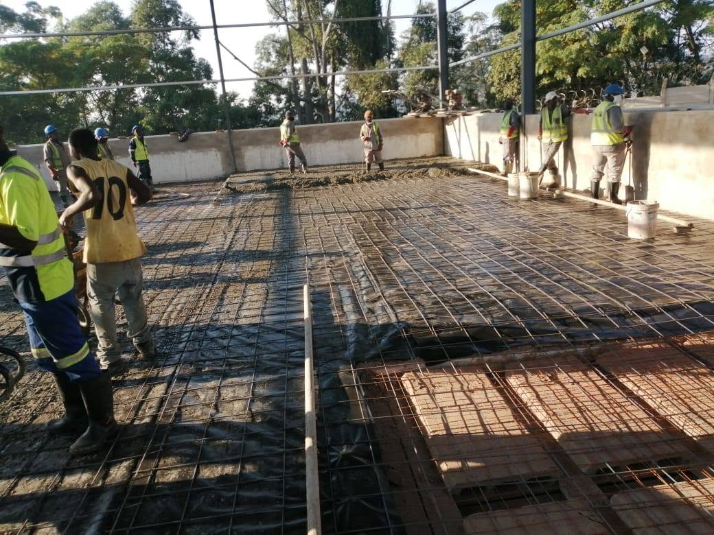 Fairy's Construction crew pouring a concrete slab